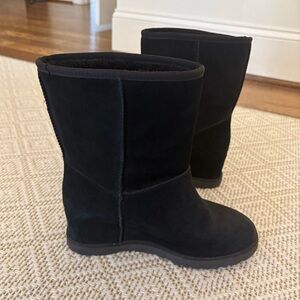 Women’s black Ugg wedge boots